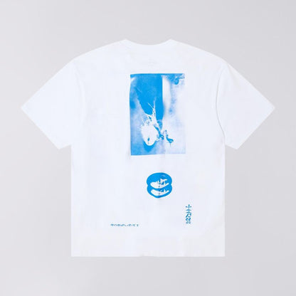 White t-shirt with blue graphic design on a light gray background