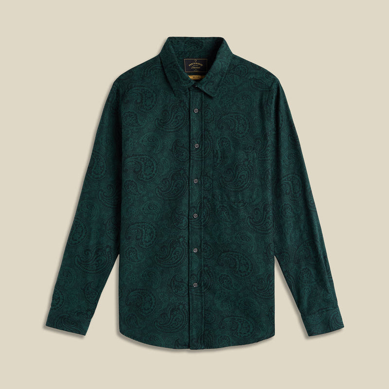 Green patterned shirt on a beige background
