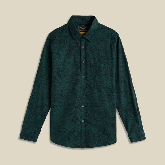 Green patterned shirt on a beige background