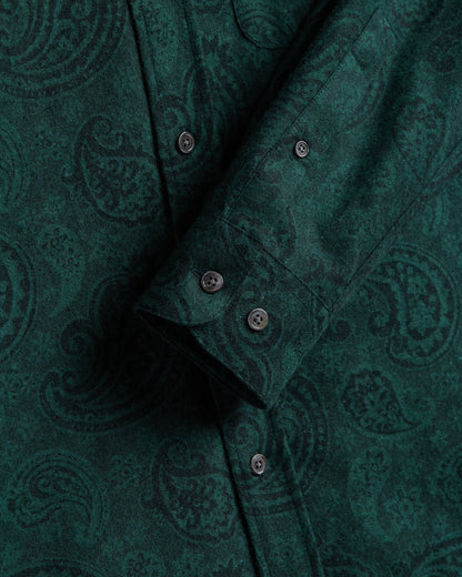 Close-up of a green patterned shirt with buttons