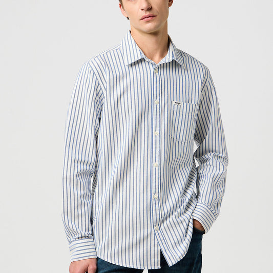 Man wearing a striped shirt against a plain background