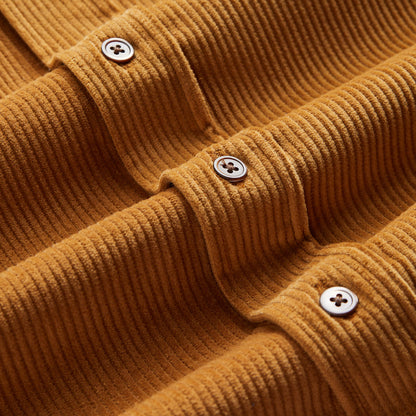 Buttons of burnt orange shirt