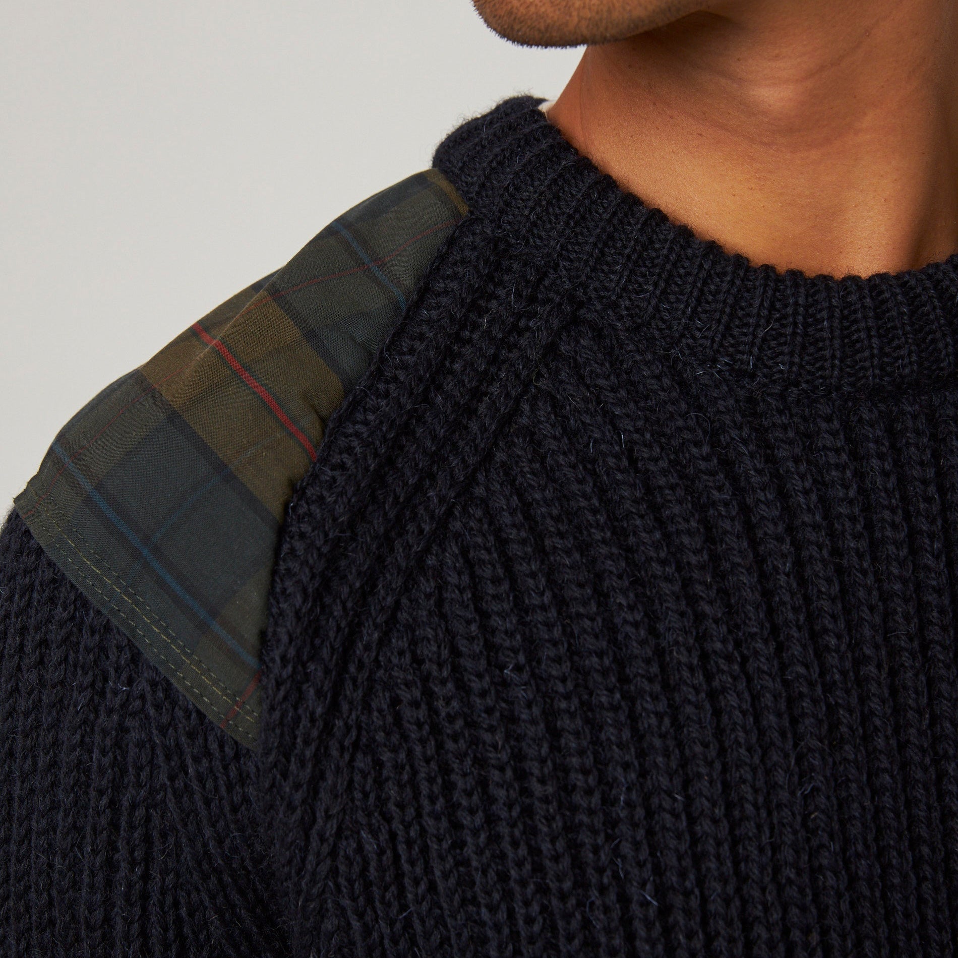 Shoulder patch on navy wool jumper