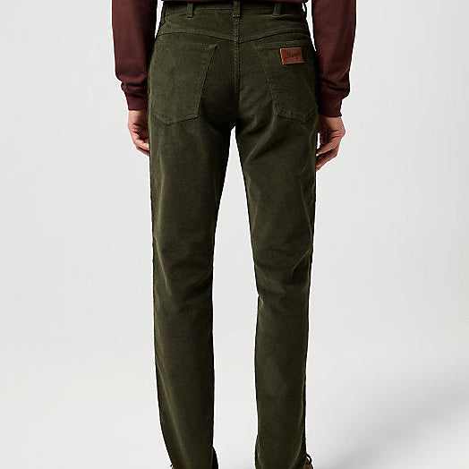 Person wearing green pants on a white background