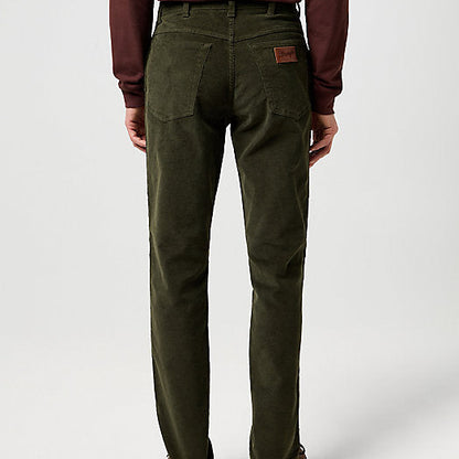 Person wearing green pants on a white background