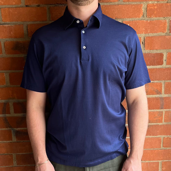 Navy blue 100% cotton lightweight and breathable polo shirt with 3 mother of pearl buttons. 