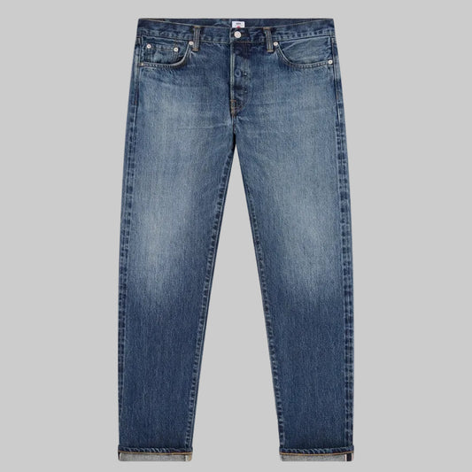 Blue jeans on a light gray background