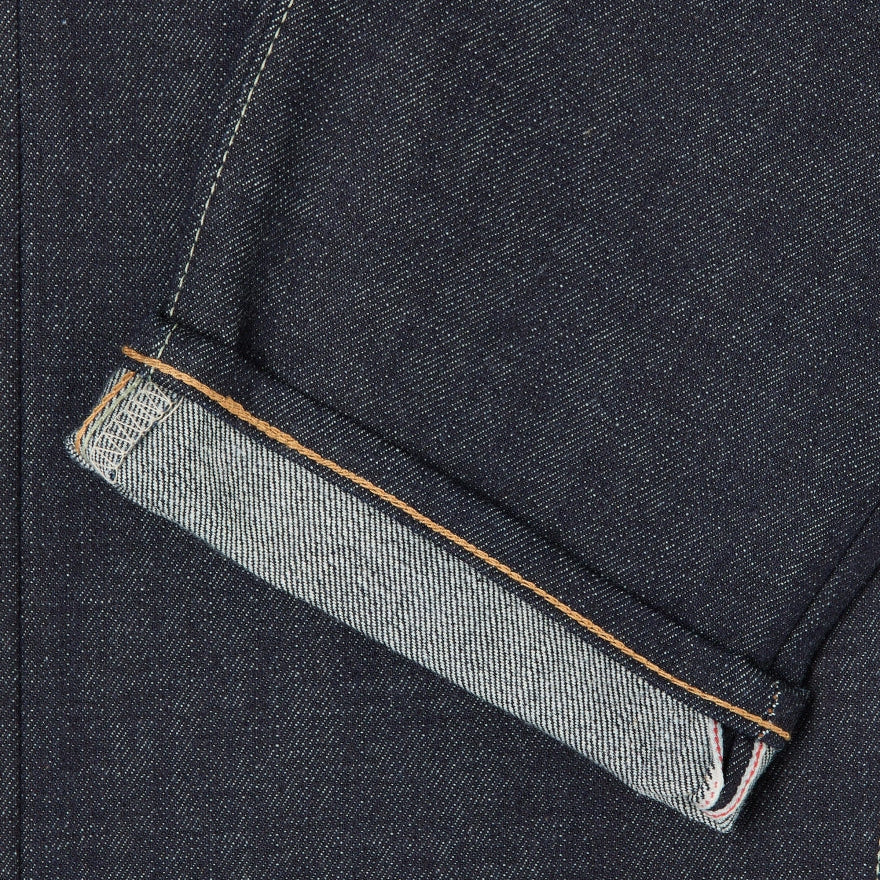 Close-up of dark denim fabric with a folded edge