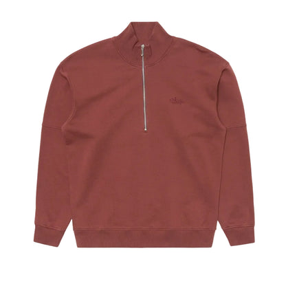 An Edwin Rum-colored quarter-zip sweatshirt with a mock neck collar and a small tonal embroidered logo on the left chest, displayed flat against a light gray background.