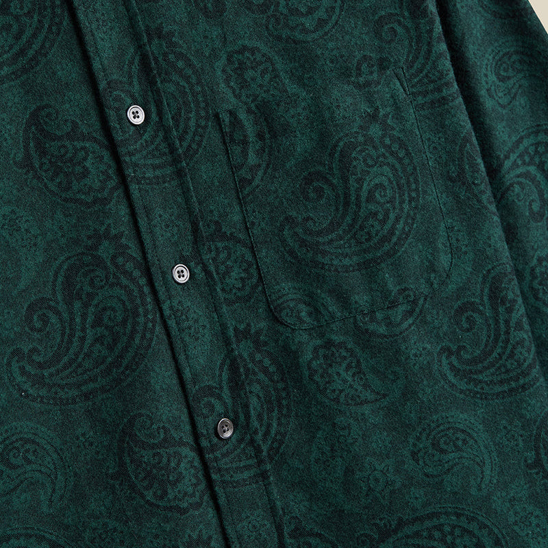 Close-up of a green patterned shirt with buttons