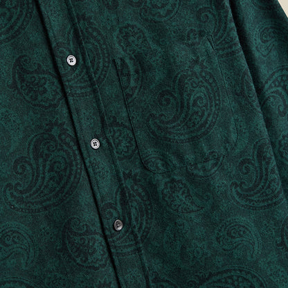 Close-up of a green patterned shirt with buttons