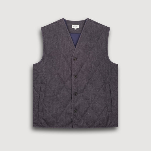 Gray quilted vest on a light gray background