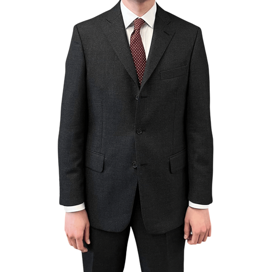 Regent Tailoring Charles suit in charcoal grey birdseye wool with a three-button jacket and slim silhouette.