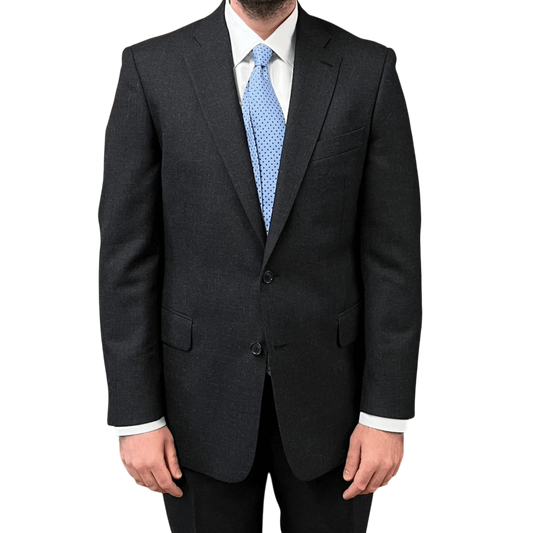 Regent Tailoring charcoal grey wool two-button suit with a light blue polka dot tie and white shirt