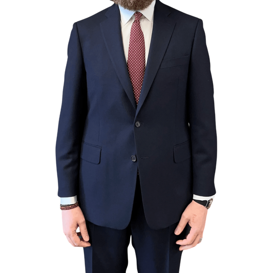 Regent Tailoring Ian two-piece suit in admiral blue wool with a white shirt and red patterned tie