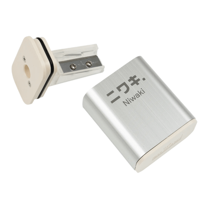 Regent Tailoring Niwaki NJK aluminium pencil sharpener with rice resin base and spare blade, made in Japan.