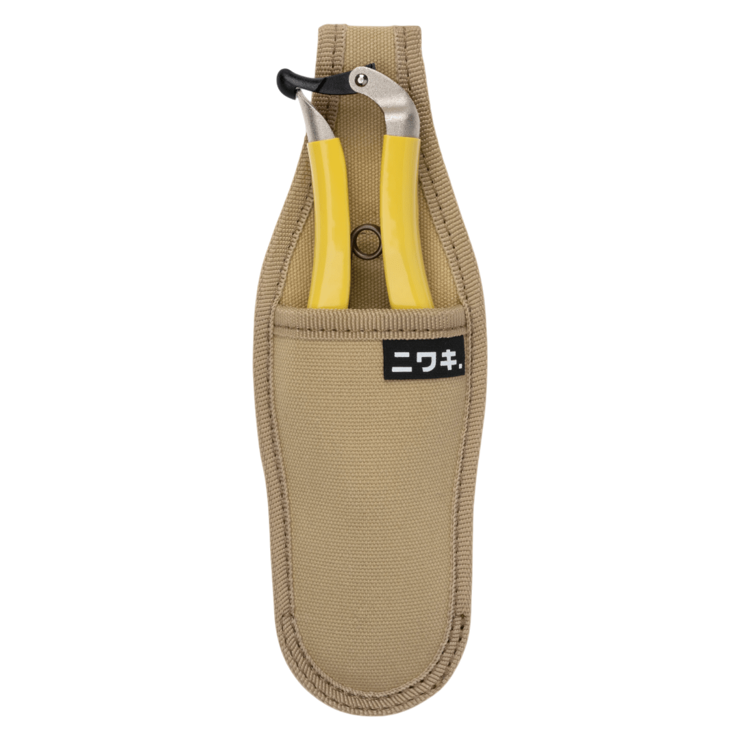 Regent Tailoring Niwaki Daikiba secateurs with yellow handles stored in a durable beige canvas holster
