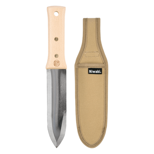 Regent Tailoring Niwaki Hori Hori gardening tool with a carbon steel blade, beech wood handle, and tan canvas holster.