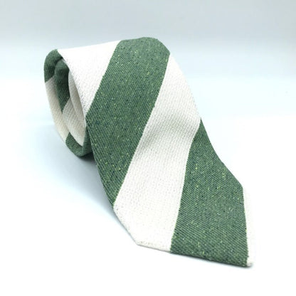 A luxury silk tie designed by and handmade exclusively for Regent. White and forest green stripes, flecked with cream, overlay a tie woven in a mixture of cotton and silk for a textured, cosy, bohemian feel.