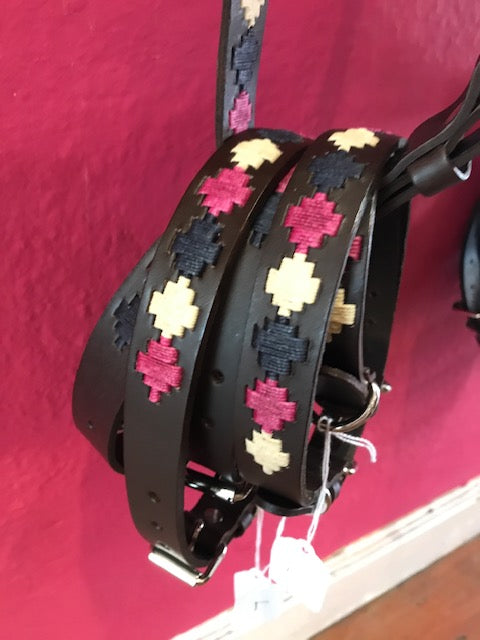 Argentinian-crafted brown bridle leather dog collar with silver-style buckle fastening and D-ring for lead attachment, featuring woven pampa crosses in bold pink, dusty pink and navy.