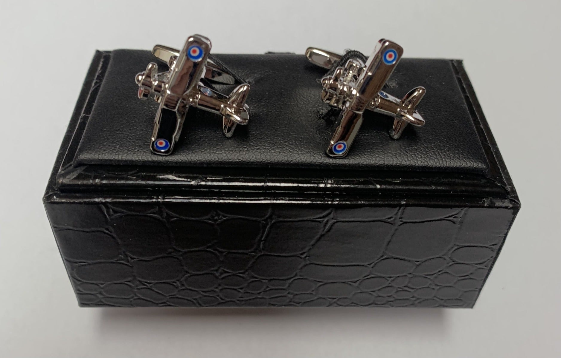 A pair of beautifully detailed cufflinks from Regent, shaped like the famous Spitfire plane, with coloured target on wings.