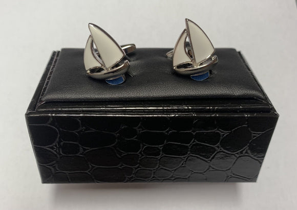 A pair of beautifully detailed cufflinks from Regent, shaped like two crisp white sailing yachts forging across the great ocean. 