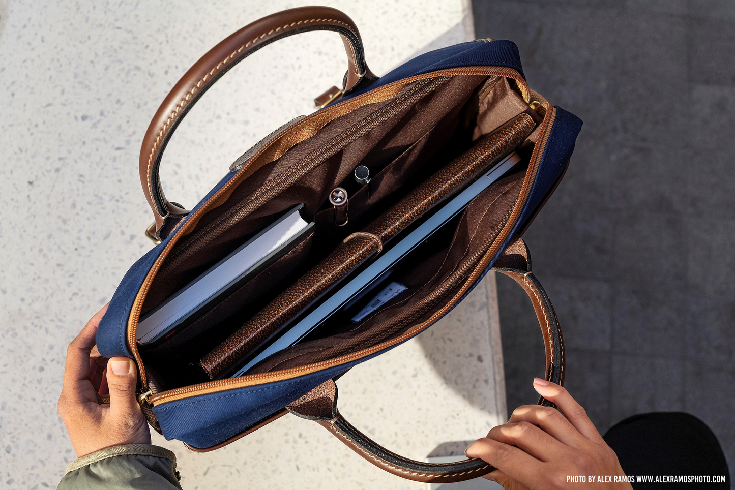 Briefcase with Laptop-Friendly design in navy from Great British travelware experts Billingham, featuring multiple interior organising pockets and 5-year guarantee. 