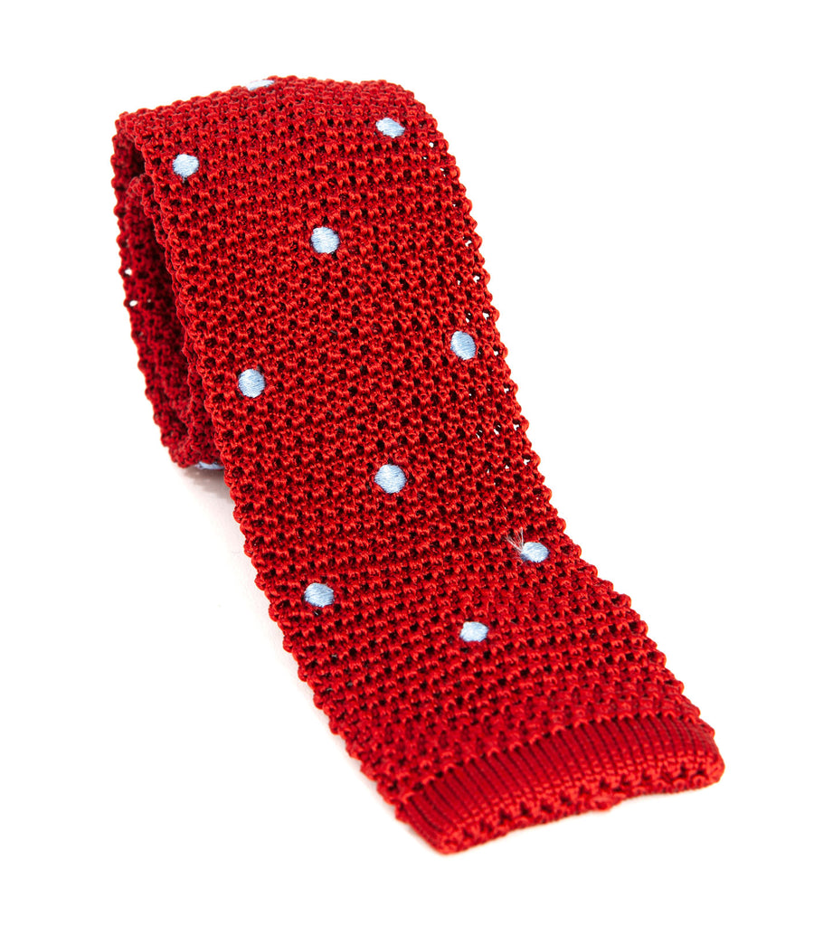 Luxury silk knitted tie designed and made exclusively for Regent. Expertly woven, with a blade width of approximately 5.5cm, this blue-spotted rich red tie from Regent is a unique, playful way to smarten up an outfit. 