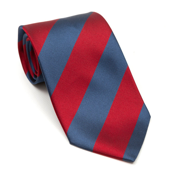 A luxury silk tie designed by and handmade exclusively for Regent. Deep slate blue and cherry red stripes combine for a striking, authoritative finish - great with a darker suit to add a dash of pizzazz. 